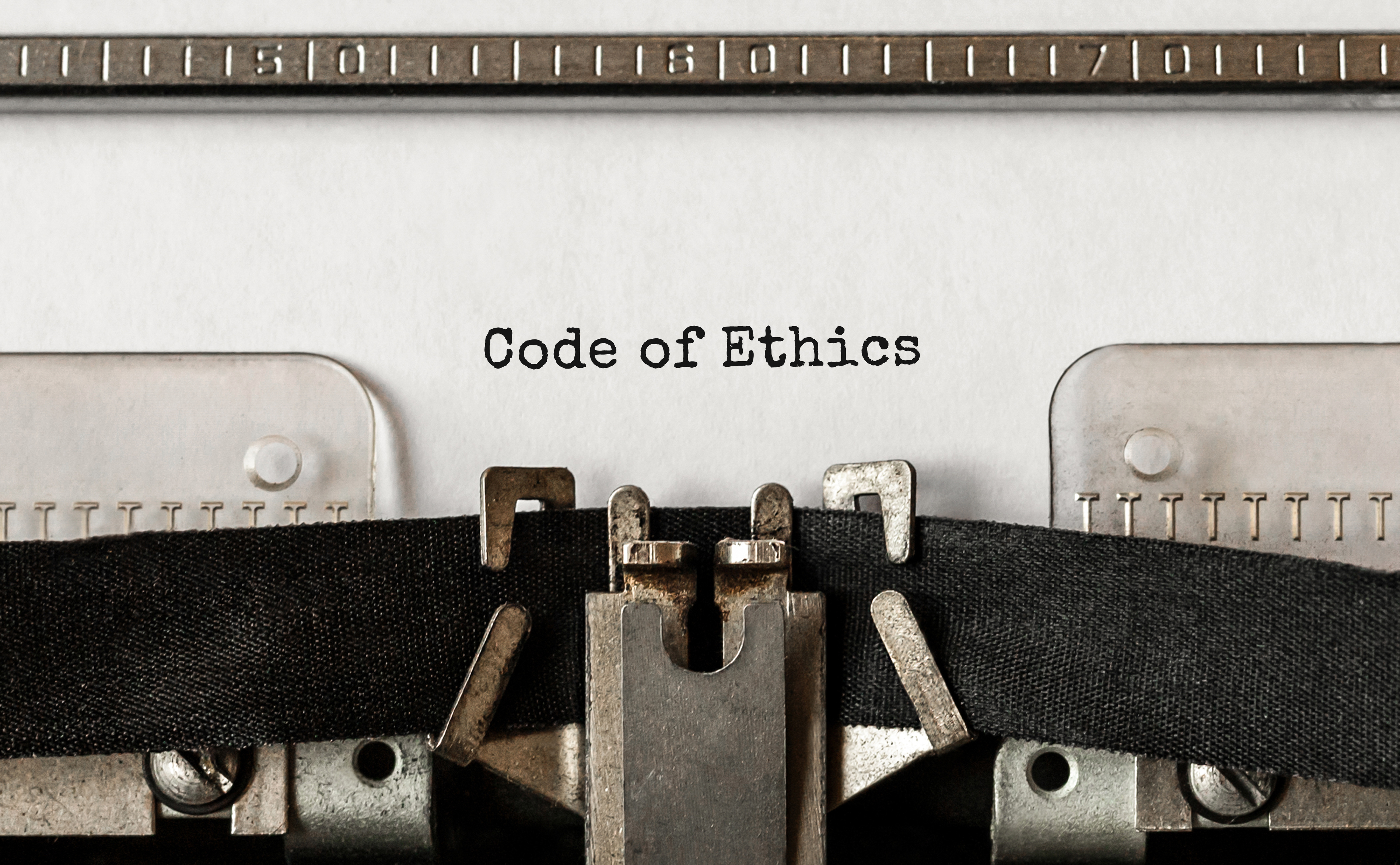 Text Code of Ethics typed on retro typewriter