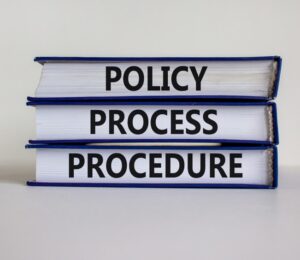 Policy, process procedure words on books