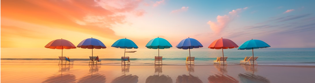 colorful chairs, umbrellas on the beach at sunset